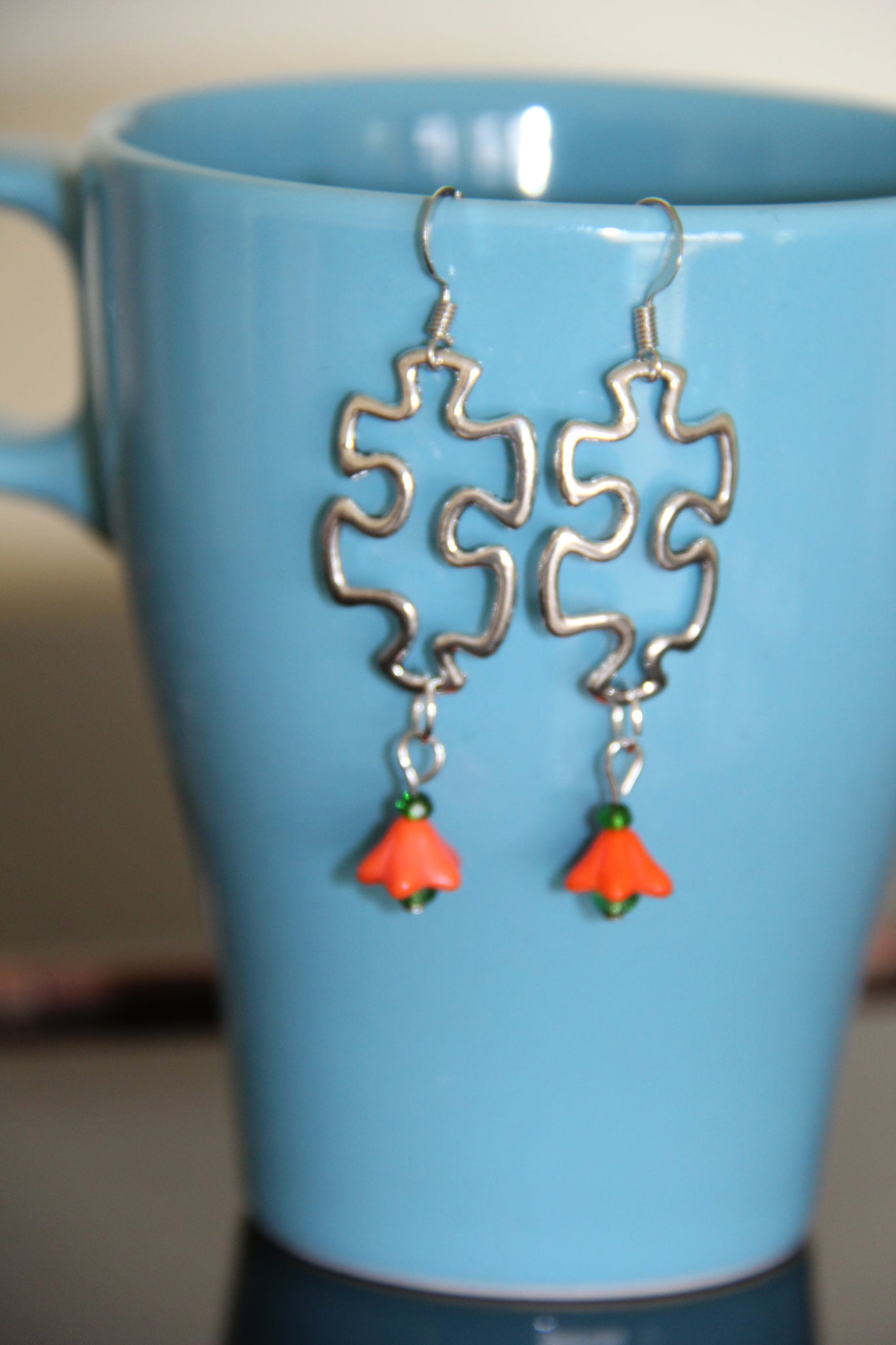 Puzzle piece ear rings Silver orange flower
