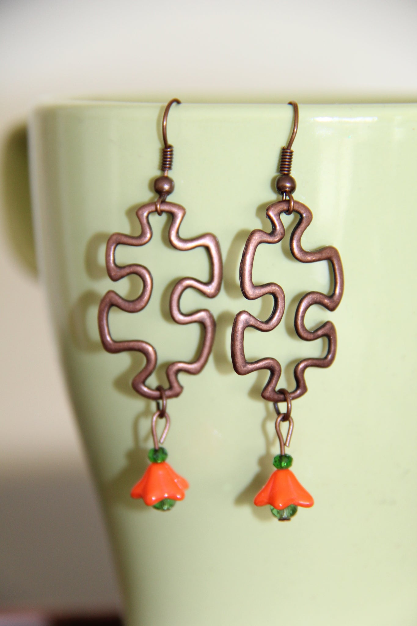 Puzzle piece ear rings Silver orange flower