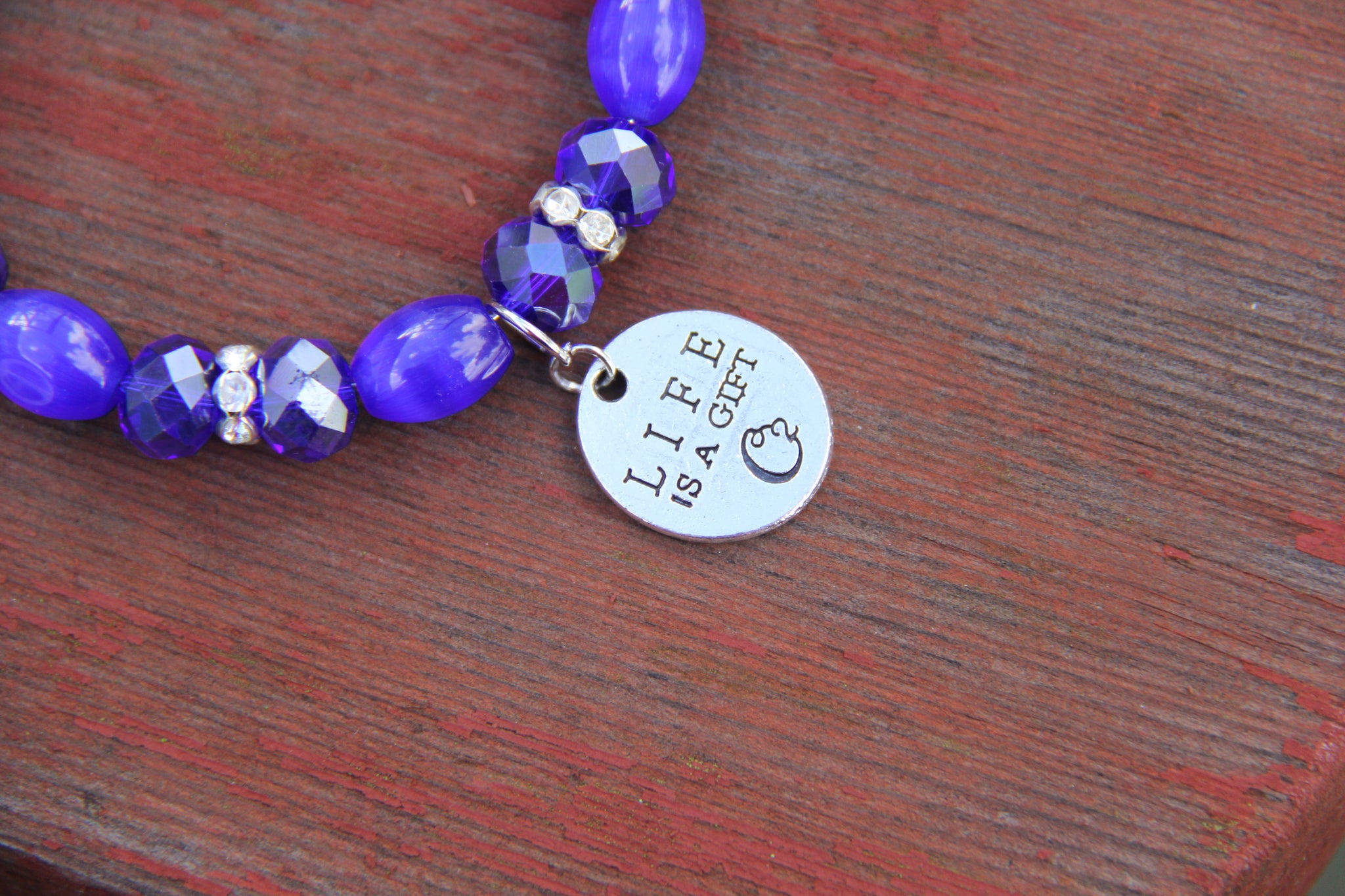 Navy blue glass beads with "Life is a gift" silver charm bottle bracelet